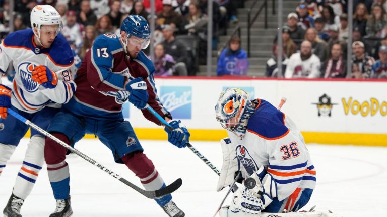 Edmonton Oilers goaltender Jack Campbell stops a shot as Oilers defenceman Philip Broberg battles for position in front of the net with Colorado Avalanche right wing Valeri Nichushkin in the first period of an NHL hockey game Sunday, Feb. 19, 2023, in Denver. (David Zalubowski/AP Photo)