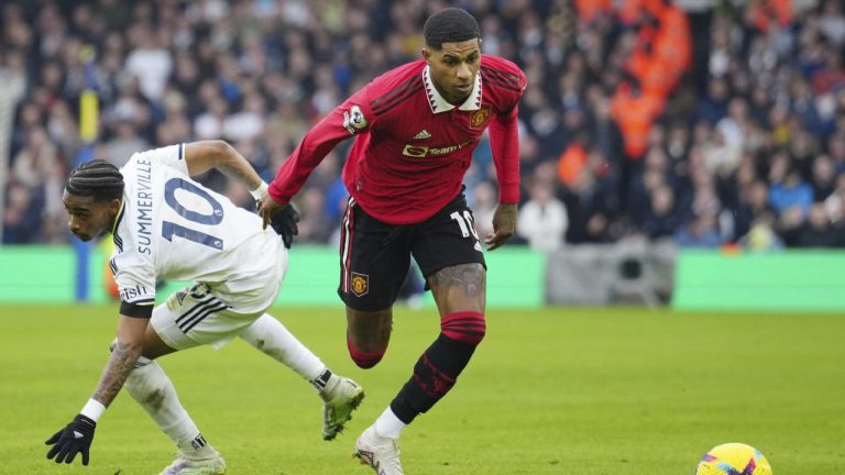 Manchester United's Marcus Rashford, right, challenges for the ball with Leeds United's Crysencio Summerville during the English Premier League soccer match between Leeds United and Manchester United at Elland Road, Leeds, England, Sunday, Feb.12, 2023. (Jon Super/AP)