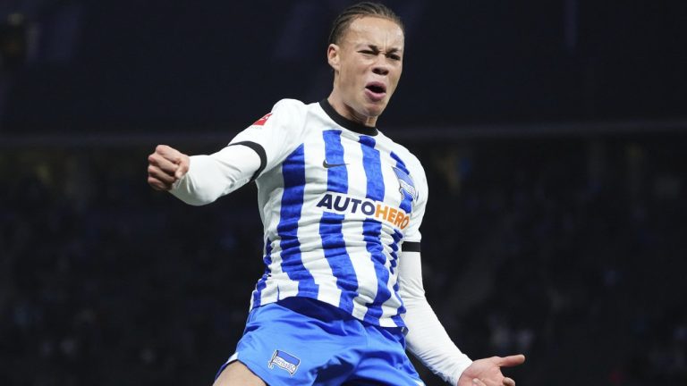 Hertha's Derry Lionel Scherhant celebrates after scoring for his side during the German Bundesliga. (Soeren Stache/dpa via AP)