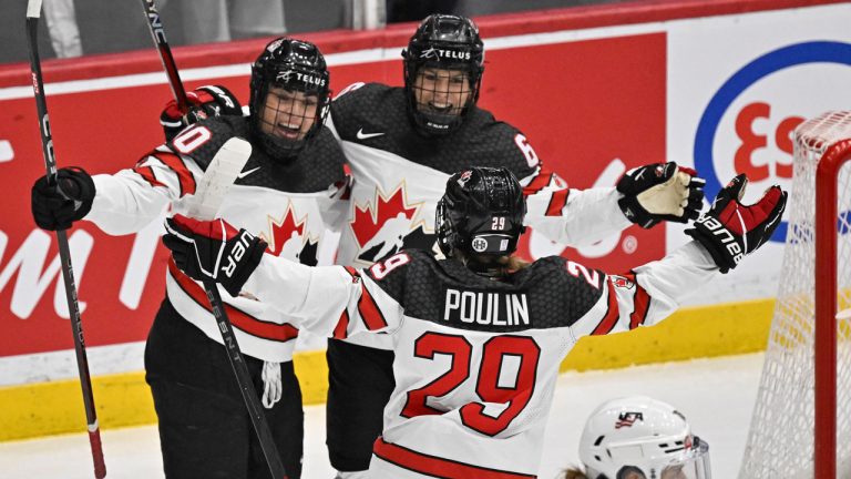 Team Canada Sarah Nurse, left, is congratulated by teammates Rebecca Johnston, right, and Marie-Philip Poulin, centre, after she scored against Team USA during first period action. (Jacques Boissinot/CP)