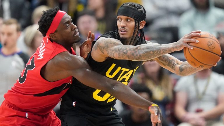 Toronto Raptors forward Pascal Siakam, left, guards Utah Jazz guard Jordan Clarkson, right, during the first half of an NBA basketball game Wednesday, Feb. 1, 2023, in Salt Lake City. (Rick Bowmer/AP)