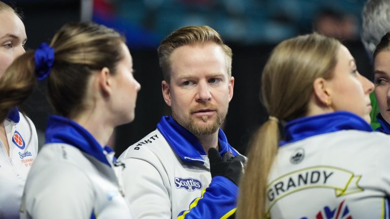 British Columbia coach Niklas Edin, back centre, talks with third Kayla MacMillan, front left, as skip Clancy Grandy, front right, looks on before playing Prince Edward Island at the Scotties Tournament of Hearts, in Kamloops, B.C., on Friday, February 17, 2023. (Darryl Dyck/CP)