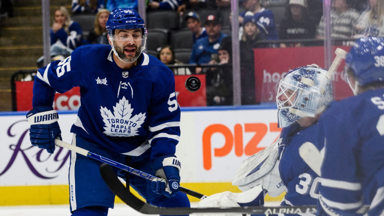 Toronto Maple Leafs defenceman Mark Giordano (55) and goaltender Matt Murray (30) watch the puck in front of the net.(Christopher Katsarov/CP)