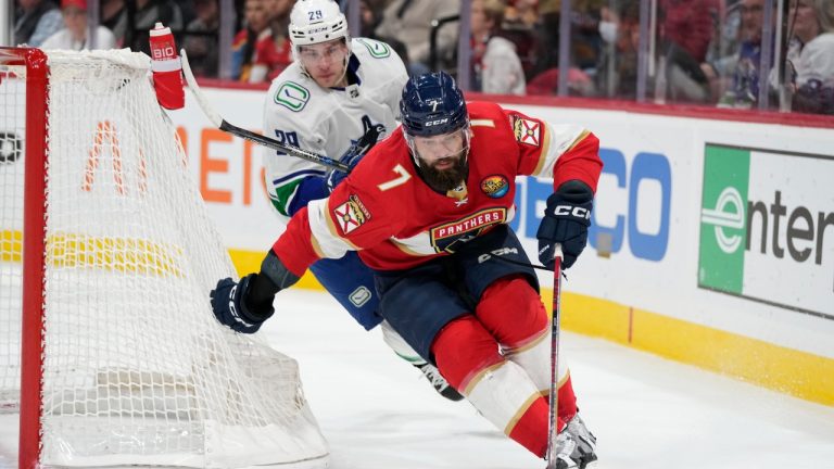 Defenceman Radko Gudas (7) and Vancouver Canucks centre Lane Pederson (29) battle for the puck during the first period of an NHL hockey game, Saturday, Jan. 14, 2023, in Sunrise, Fla. (Wilfredo Lee/AP Photo)