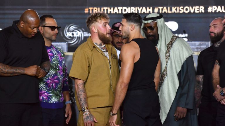 Jake Paul, centre left, and Tommy Fury, centre right, face off after their press conference before their fight, scheduled on Feb. 26, in Riyadh, Saudi Arabia, Thursday, Feb. 23, 2023. (AP Photo)