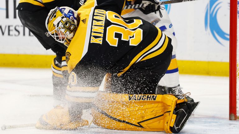 Boston Bruins goaltender Keith Kinkaid (30) covers the puck during the first period of the team's NHL hockey game. (Jeffrey T. Barnes/AP)