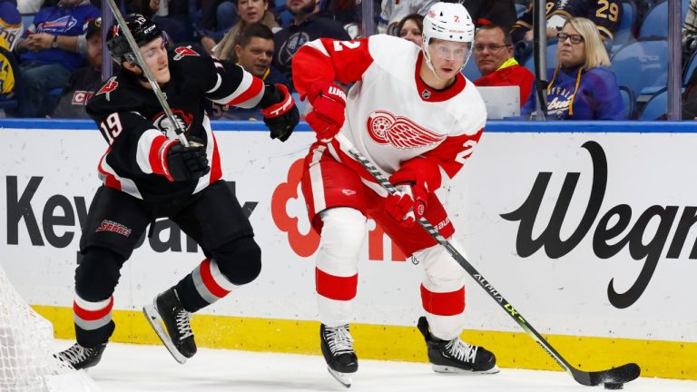 Detroit Red Wings defenseman Olli Maatta (2) is pressured by Buffalo Sabres center Peyton Krebs (19) during the first period of an NHL hockey game Thursday, Dec. 29, 2022, in Buffalo, N.Y. (Jeffrey T. Barnes/AP)