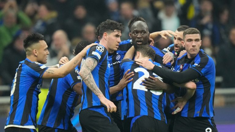 Inter Milan's Romelu Lukaku, center, is cheered by teammates after scoring during the Champions League, round of 16, first leg soccer match between Inter Milan and Porto, at the San Siro stadium in Milan, Italy, Wednesday, Feb. 22, 2023. (Luca Bruno/AP Photo)