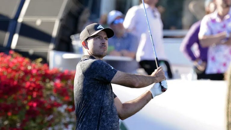 Nick Taylor watches his shot on the 16th hole during the third round of the Phoenix Open golf tournament. (Darryl Webb/AP)