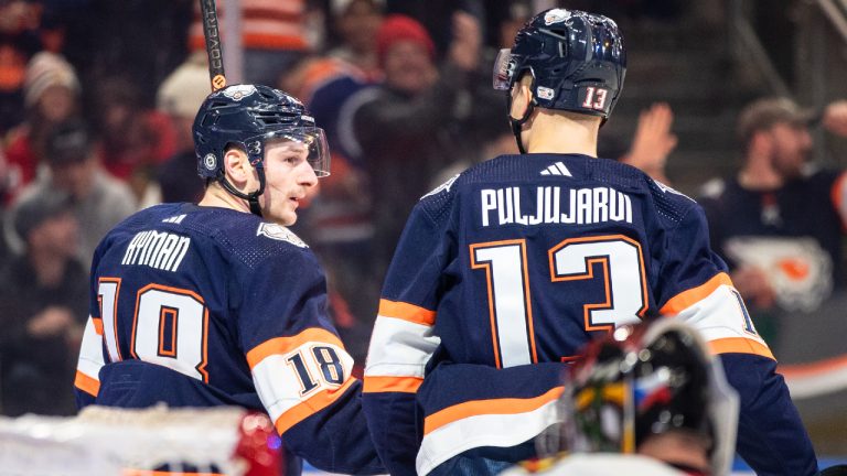 Edmonton Oilers' Zach Hyman (18) and Jesse Puljujarvi (13) celebrate a goal against the Chicago Blackhawks during second period NHL action in Edmonton on Saturday January 28, 2023.(Jason Franson/CP)