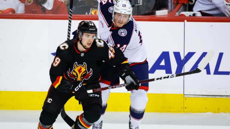 Columbus Blue Jackets forward Gustav Nyquist, right, and Calgary Flames forward Jakob Pelletier chase the play during second period NHL hockey action in Calgary, Monday, Jan. 23, 2023. (Jeff McIntosh/CP)