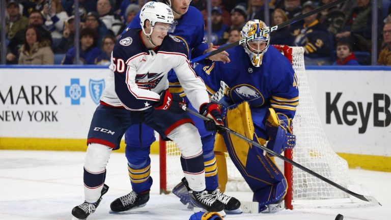 Columbus Blue Jackets left wing Eric Robinson and Buffalo Sabres defenseman Owen Power battle for the puck in front of goaltender Craig Anderson during the second period of an NHL hockey game, Tuesday, Feb. 28, 2023, in Buffalo, N.Y. (Jeffrey T. Barnes/AP)