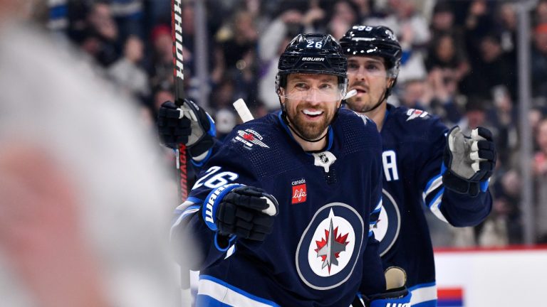 Winnipeg Jets' Blake Wheeler (26) celebrates his goal against the Seattle Kraken with Mark Scheifele (55) during second period NHL action in Winnipeg on Tuesday February 14, 2023. (Fred Greenslade/CP)