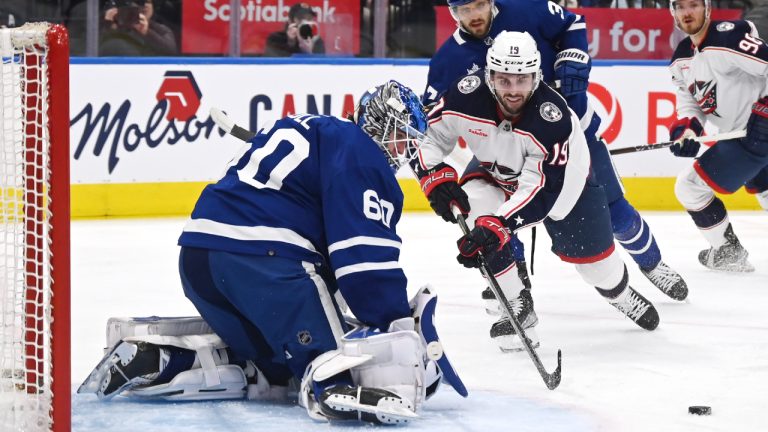 Toronto Maple Leafs goaltender Joseph Woll (60) makes a stop on Columbus Blue Jackets centre Liam Foudy (19) during first period NHL action on Saturday, Feb. 11, 2023 in Toronto. (Jon Blacker/CP)