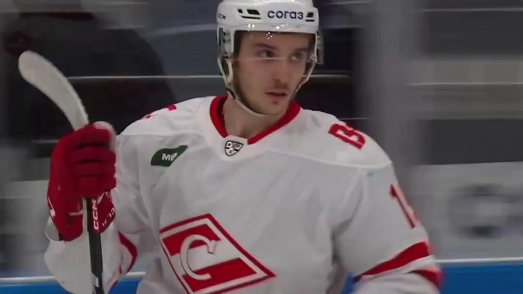 Winnipeg Jets' Nikita Chibrikov (90) checks Edmonton Oilers' James