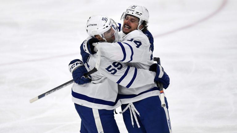 Toronto Maple Leafs centre Auston Matthews celebrates scoring a goal with teammate Mark Giordano during the second period of an NHL hockey game against the Florida Panthers, Thursday, March 23, 2023, in Sunrise, Fla. (Michael Laughlin/AP)