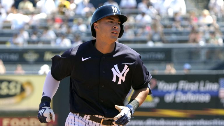 New York Yankees' Anthony Volpe rounds the bases after hitting a two run homer in the second inning of a spring training baseball game against the Minnesota Twins, Friday, March 24, 2023, in Tampa, Fla. (John Raoux/AP)