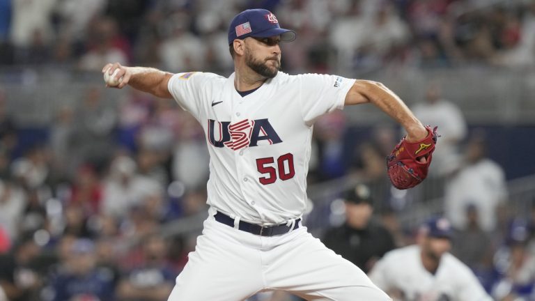 U.S. starting pitcher Adam Wainwright (50) aims a pitch during the first inning of a World Baseball Classic game against Cuba, Sunday, March 19, 2023, in Miami. (Marta Lavandier)