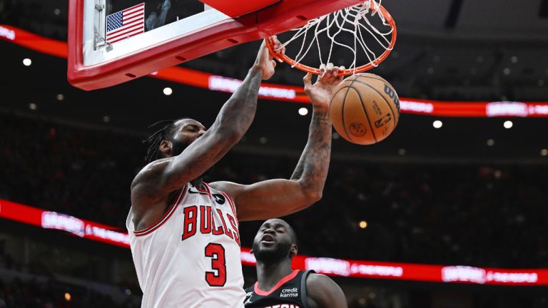 Chicago Bulls center Andre Drummond (3) dunks against Houston Rockets forward Usman Garuba (16) during the second half of an NBA basketball game Monday, Dec. 26, 2022, in Chicago. (Quinn Harris/AP)