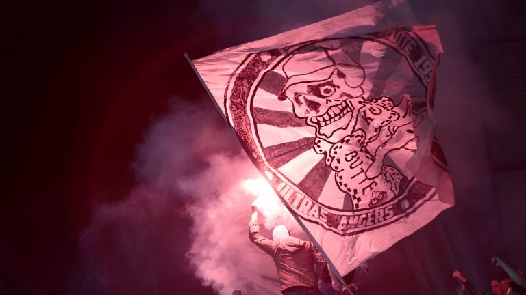 Angers supporters sing during the League One soccer match between Angers and Paris Saint Germain, at the Raymond-Kopa stadium in Angers, western France, Wednesday, April 20, 2022. (Jeremias Gonzalez/AP)