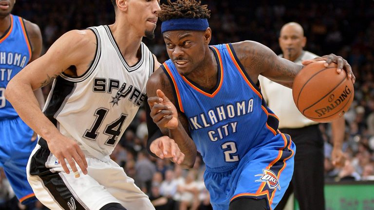 Oklahoma City Thunder guard Anthony Morrow drives around San Antonio Spurs guard Danny Green during the first half of an NBA basketball game, Tuesday, Jan. 31, 2017, in San Antonio. (Darren Abate/AP)