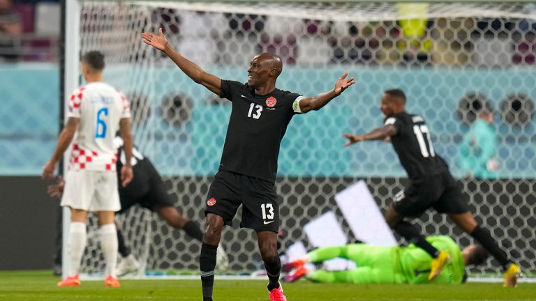 Canada's Atiba Hutchinson celebrates after Canada's Alphonso Davies scored his side's opening goal during the World Cup group F soccer match between Croatia and Canada, at the Khalifa International Stadium in Doha, Qatar, Sunday, Nov. 27, 2022. (Aijaz Rahi/AP)