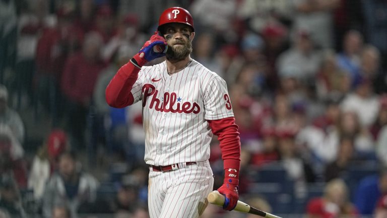 Philadelphia Phillies' Bryce Harper walks to the dugout after striking out during the fourth inning in Game 4 of baseball's World Series between the Houston Astros and the Philadelphia Phillies on Wednesday, Nov. 2, 2022, in Philadelphia. (David J. Phillip/AP)