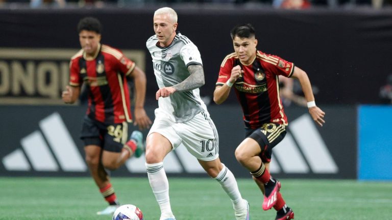 Toronto FC forward Federico Bernardeschi drives past Atlanta United defender Caleb Wiley and Atlanta United midfielder Luiz Araújo during the first half of an MLS soccer match, Saturday, March 4, 2023, in Atlanta. (Alex Slitz/AP Photo)