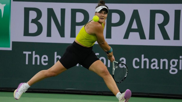 Bianca Andreescu, of Canada, returns a shot to Iga Swiatek, of Poland, at the BNP Paribas Open tennis tournament Monday, March 13, 2023, in Indian Wells, Calif. (AP)