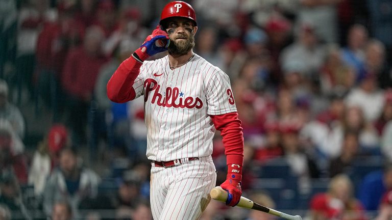 Philadelphia Phillies' Bryce Harper walks to the dugout after striking out during the fourth inning in Game 4 of baseball's World Series between the Houston Astros and the Philadelphia Phillies on Wednesday, Nov. 2, 2022, in Philadelphia. (David J. Phillip)