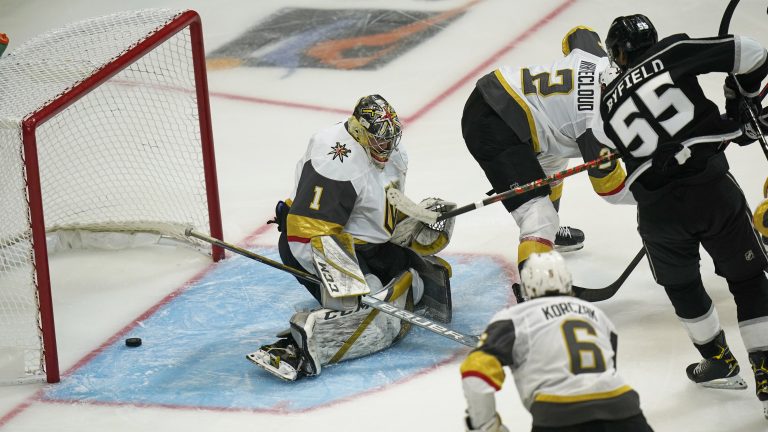 Los Angeles Kings center Quinton Byfield makes an assist as Vegas Golden Knights goaltender Dylan Ferguson is scored against during the third period of an NHL hockey preseason game Thursday, Sept. 30, 2021, in Salt Lake City. (Rick Bowmer/AP)