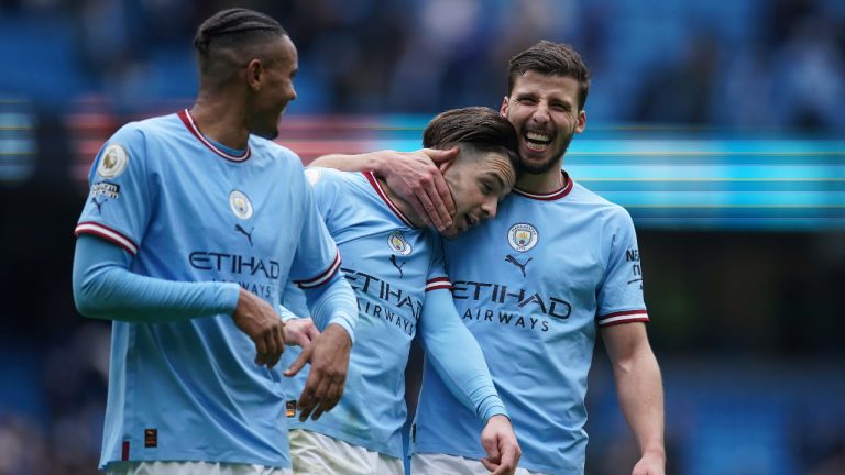 From left, Manchester City's Manuel Akanji and his teammates Jack Grealish and Ruben Dias celebrate at the end of the English Premier League soccer match between Manchester City and and Newcastle. (Dave Thompson/AP)