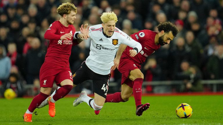 Liverpool's Harvey Elliott, left, and Mo Salah challenge Manchester United's Alejandro Garnacho during the English Premier League soccer match between Liverpool and Manchester United at Anfield in Liverpool, England, Sunday, March 5, 2023. (Jon Super/AP) 