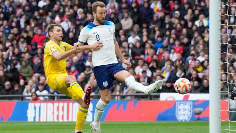 England's Harry Kane scores his side's opening goal during the Euro 2024 group C qualifying soccer match between England and Ukraine at Wembley Stadium in London, Sunday, March 26, 2023. (Alastair Grant/AP) 