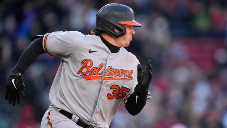 Baltimore Orioles' Adley Rutschman dashes down the first base line on his RBI single in the seventh inning of an opening day baseball game against the Boston Red Sox at Fenway Park, Thursday, March 30, 2023, in Boston. (Charles Krupa/AP)