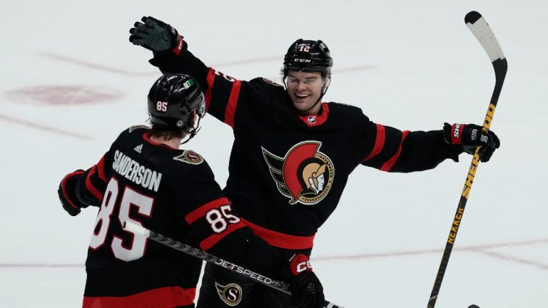 Ottawa Senators defenceman Jake Sanderson races to congratulate right wing Alex DeBrincat on his game winning goal in overtime against the Philadelphia Flyers, Thursday, March 30, 2023 in Ottawa. Adrian Wyld/THE CANADIAN PRESS