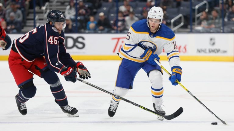 Buffalo Sabres' Anders Bjork, right, looks for an open pass as Columbus Blue Jackets' Joona Luoto defends during the first period of an NHL preseason hockey game Wednesday, Sept. 28, 2022, in Columbus, Ohio. (AP Photo/Jay LaPrete)