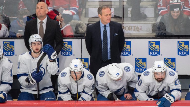 Tampa Bay Lightning's head coach Jon Cooper, centre, looks on during an NHL hockey game against the Montreal Canadiens in Montreal, Saturday, December 17, 2022. (Graham Hughes/CP) 