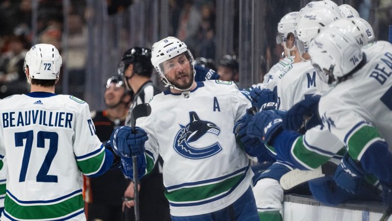 Vancouver Canucks center J.T. Miller (9) celebrates after his goal with his teammates during the first period of an NHL hockey game against the Anaheim Ducks in Anaheim, Calif., Sunday, March 19, 2023. (Kyusung Gong/AP)