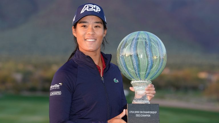 Celine Boutier holds up the Drive On Championship trophy after winning on a playoff hole during the final round of the Drive On Championship golf tournament, Sunday, March 26, 2023, in Gold Canyon, Ariz. (Darryl Webb/AP)