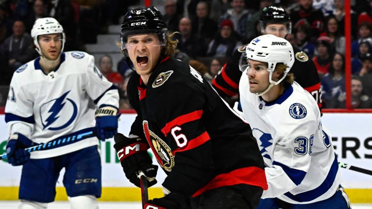 Ottawa Senators defenceman Jakob Chychrun (6) shouts after a shot from the Tampa Bay Lightning as he defends with goaltender Mads Sogaard (40), during first period NHL hockey action in Ottawa, Thursday, March 23, 2023. (Justin Tang/CP)