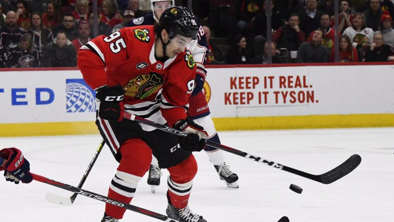 Chicago Blackhawks right wing Dylan Sikura (95) moves the puck against the Columbus Blue Jackets during the first period of an NHL hockey game Saturday, Feb. 16, 2019, in Chicago. (Matt Marton/AP)