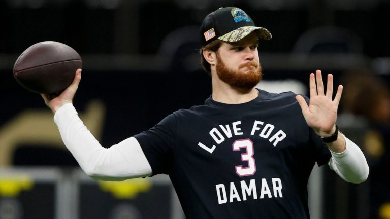 Carolina Panthers quarterback Sam Darnold warms up wearing a T-shirt in support of Damar Hamlin before an NFL football game between the Carolina Panthers and the New Orleans Saints in New Orleans, Sunday, Jan. 8, 2023. (Butch Dill/AP Photo)