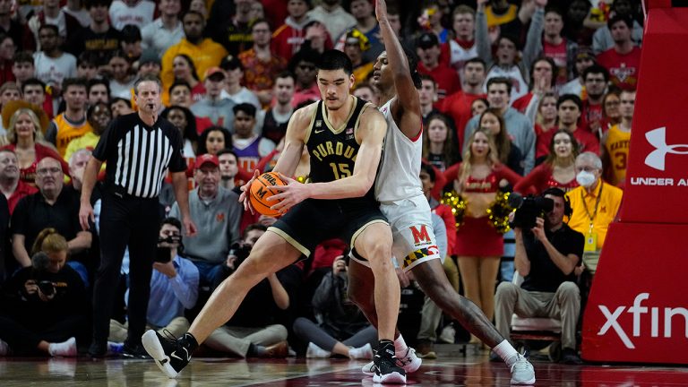 Purdue center Zach Edey, left, works his way toward the basket against Maryland forward Julian Reese during the second half of an NCAA college basketball game, Thursday, Feb. 16, 2023, in College Park, Md. (Julio Cortez/AP)