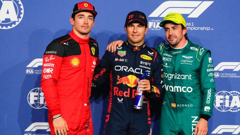 From left: Ferrari driver Charles Leclerc of Monaco, Red Bull driver Sergio Perez of Mexico and Aston Martin driver Fernando Alonso of Spain pose for a photo after the qualifying session ahead of the Formula One Grand Prix at the Jeddah corniche circuit in Jeddah, Saudi Arabia, Saturday, March 18, 2023. Sergio Perez stepped up for Red Bull to ensure the team started from the pole at the Saudi Arabian Grand Prix after a mechanical issue sidelined two-time defending world champion Max Verstappen. (Hassan Ammar/AP)