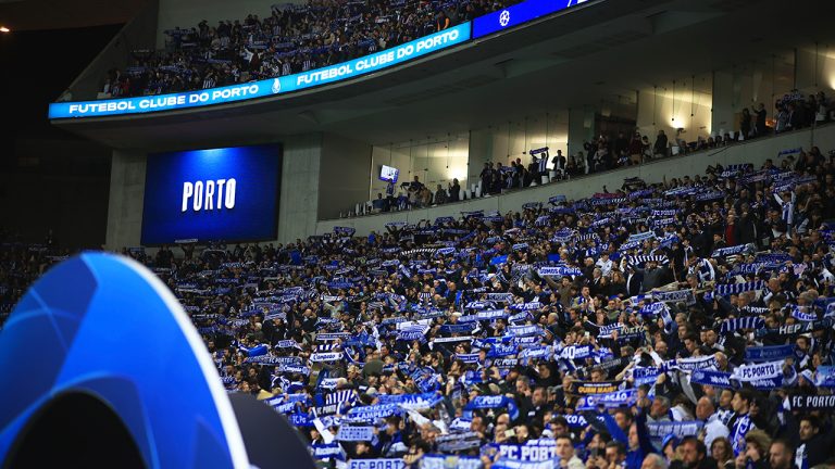 Porto fans hold up their scarves during the Champions League round of 16, 2nd leg, soccer match between FC Porto and Inter Milan at the Dragao stadium in Porto, Portugal, Tuesday, March 14, 2023. (Luis Vieira/AP)