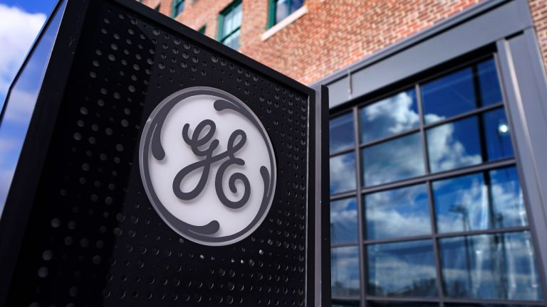 The General Electric logo is displayed on a sign outside their headquarters. (Charles Krupa/AP)