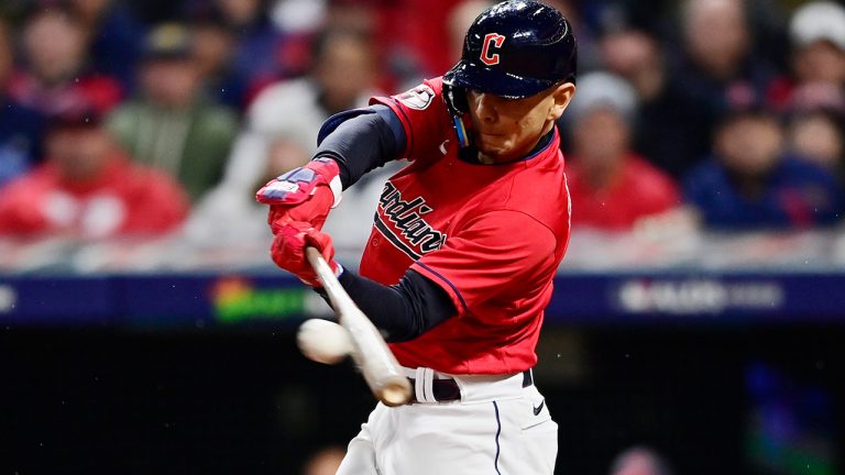 Cleveland Guardians' Andres Gimenez singles in the seventh inning of Game 4 of a baseball AL Division Series against the New York Yankees, Sunday, Oct. 16, 2022, in Cleveland. (David Dermer/AP)