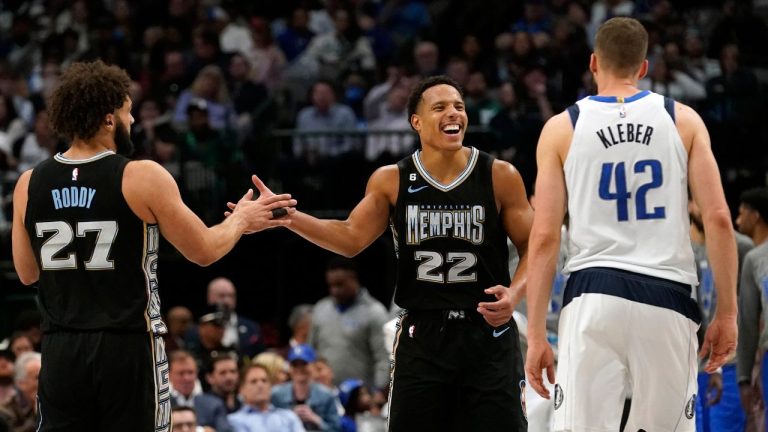 Memphis Grizzlies guard Desmond Bane  celebrates with teammate David Roddy in front of Dallas Mavericks forward Maxi Kleber during the second half of an NBA basketball game in Dallas, Monday, March 13, 2023. (LM Otero/AP Photo)