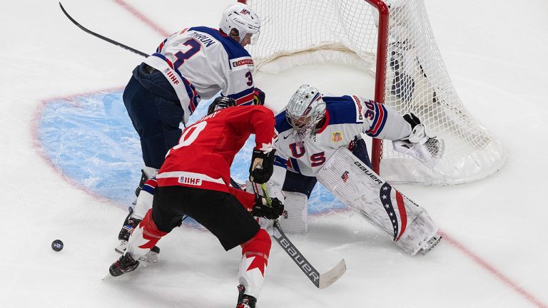 Canada's Dylan Holloway (10) is stopped by United States goalie Spencer Knight (30) as Henry Thrun (3) defends during first period IIHF World Junior Hockey Championship gold medal game action in Edmonton on Tuesday, January 5, 2021. (Jason Franson/CP)